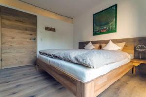 Voodi või voodid majutusasutuse INVITA Natur-Chalets toas
