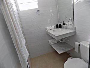 Kúpeľňa v ubytovaní Sorrento Suítes Maragogi a 3 min da Orla