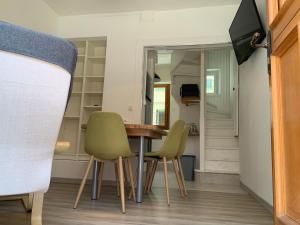 a dining room with a table and two chairs at Villa Georges in Le Tréport