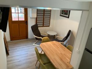 a dining room with a table and chairs at Villa Georges in Le Tréport