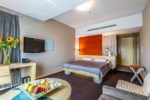 Postel nebo postele na pokoji v ubytování Niebieski Art Hotel & Spa