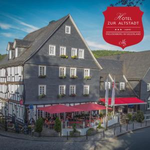 a rendering of a building with a restaurant at Hotel zur Altstadt in Freudenberg