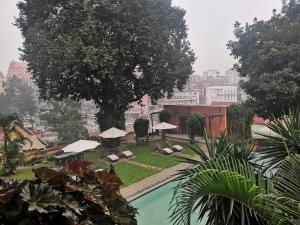 a view of a resort with a swimming pool at Maison d'Hôtes Mandrosoa in Antananarivo