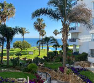 a view of the ocean from the balcony of a resort at Mi Capricho Apartment with Sea Views and Gardens in La Cala de Mijas