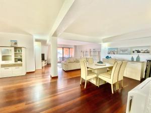 a living room with a table and chairs at Marina Garden by Ethnic Ocean in Vilamoura