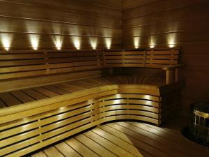 an empty sauna with lights on top of it at Sport Hotel Kantri in Kankaanpää