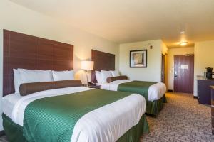 a hotel room with two beds in a room at Cobblestone Inn & Suites - Lakin in Lakin