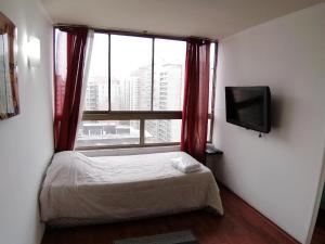 เตียงในห้องที่ Santiago Moneda Suites