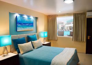 Postel nebo postele na pokoji v ubytování Baja Inn Hoteles Ensenada