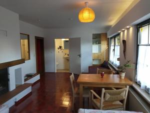 a dining room and living room with a table at Pension Köthen in Köthen