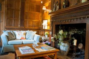 a living room filled with furniture and a fireplace at Baye House in Colchester