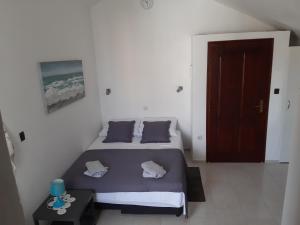 Postel nebo postele na pokoji v ubytování Apartmani Pilon