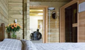 a bedroom with a bed and a fireplace in a room at 6 persoons vakantiehuis met sauna, dichtbij zee in Sint Annaland