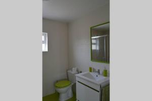 a bathroom with a toilet and a sink and a mirror at Casa 4 Estaçoes in Batalha +14 photos