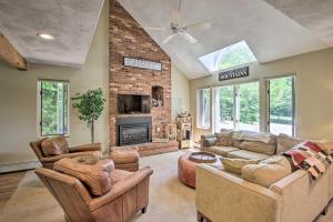a living room with a couch and a fireplace at Bartlett Condo with Mtn View Deck Less Than 1 Mi to Skiing! in Bartlett