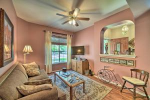 a living room with a couch and a ceiling fan at Upscale San Antonio Home with Screened-In Porch in San Antonio