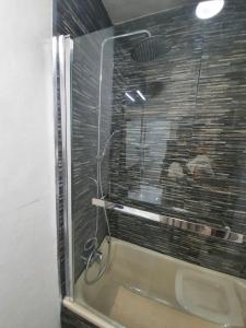 a shower with a glass door in a bathroom at CASA DE SILVA in Valladolid