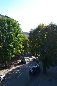 a view of a street with cars parked on the road at Smart in Ternopilʼ