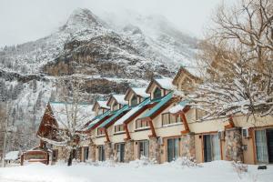 a snow covered ski slope with a ski lift at Waterton Glacier Suites in Waterton Park