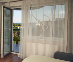 Posteľ alebo postele v izbe v ubytovaní Apartman A&M