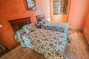 Cama o camas de una habitación en Hotel Rural Pajarapinta