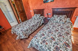 Cama o camas de una habitación en Hotel Rural Pajarapinta