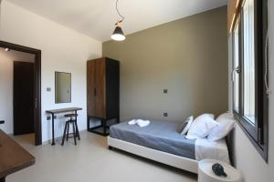 Postel nebo postele na pokoji v ubytování Orion Eco Suites