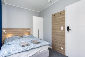 Postel nebo postele na pokoji v ubytování Hugo
