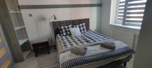
Łóżko lub łóżka w pokoju w obiekcie Nad Rustiką
