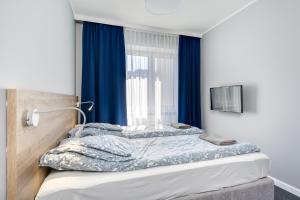 Postel nebo postele na pokoji v ubytování Hugo