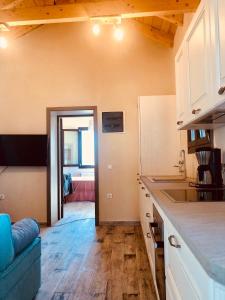 a kitchen with a counter top and a room at Seaside Villa Eleni in Chorefto