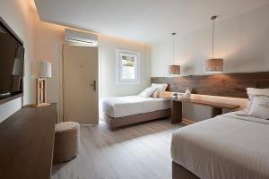 Cama ou camas em um quarto em Palladium Hotel
