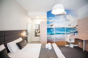 מיטה או מיטות בחדר ב-Hotel Gdynia Boutique