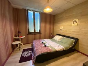 מיטה או מיטות בחדר ב-La Cigale