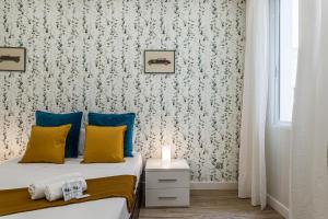 Łóżko lub łóżka w pokoju w obiekcie Waou Malasaña III - Alquiler Corta Duración
