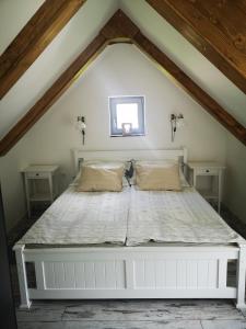 a bedroom with a bed in a attic at VeleLak in Velence