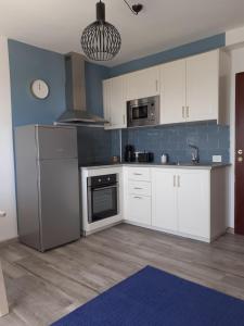 A kitchen or kitchenette at KC home abroad panoramic sea view