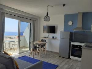 A kitchen or kitchenette at KC home abroad panoramic sea view