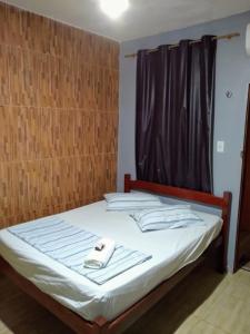 Un pat sau paturi într-o cameră la Mapará Beach hotel-Baião-Pará
