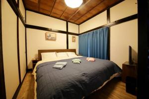 Кровать или кровати в номере 押上シエルロッジ