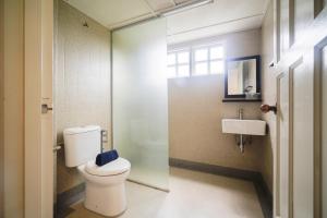 a bathroom with a toilet and a sink at Parkland Suites in Brinchang +62 photos