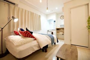 Postel nebo postele na pokoji v ubytování R-Guest Residence 東京浅草 east2