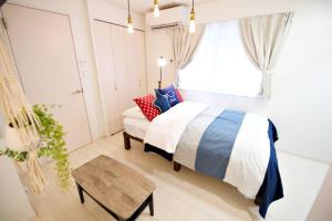Postel nebo postele na pokoji v ubytování R-Guest Residence 東京浅草 east2