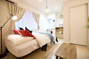 Postel nebo postele na pokoji v ubytování R-Guest Residence 東京浅草 east2