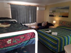 Voodi või voodid majutusasutuse Snowdream Motel toas