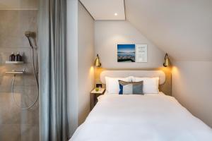 Ein Bett oder Betten in einem Zimmer der Unterkunft Hotel Felix