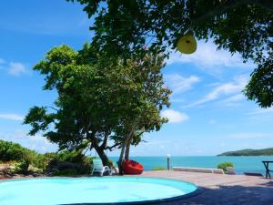 a swimming pool with a view of the ocean at Vimarn Samed Resort in Ko Samed