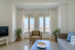 A seating area at Maisuit apartment Malaga city center