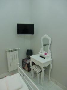 Televiisor ja/või meelelahutuskeskus majutusasutuses Guesthouse Aaron2