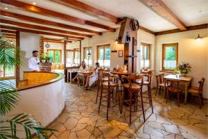 a restaurant with people sitting at tables in a room at Landhotel Gut Wildberg in Meißen